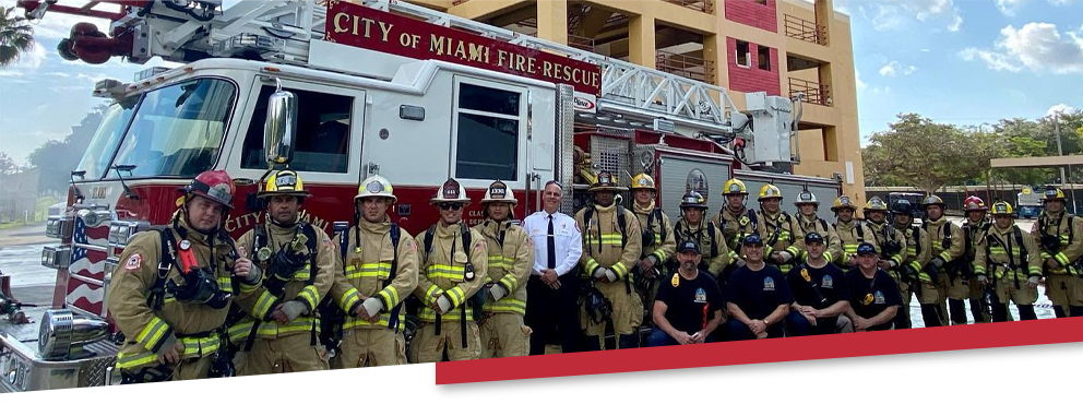 Firefighters in front of firetruck