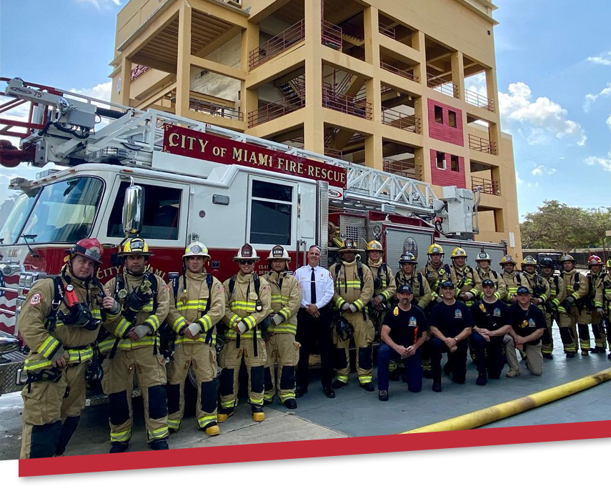 Firefighters in front of firetruck